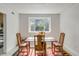 Bright dining room with a wood table, woven chairs, and a colorful rug adding a touch of charm at 2137 Wappoo Dr, Charleston, SC 29412