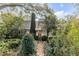 Charming front exterior with lush landscaping and a brick pathway at 2137 Wappoo Dr, Charleston, SC 29412