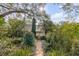 Charming home featuring a beautiful brick walkway and lush greenery enhancing its curb appeal at 2137 Wappoo Dr, Charleston, SC 29412