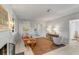 Bright living room with a fireplace, light walls, a brown rug, and large windows at 2137 Wappoo Dr, Charleston, SC 29412