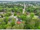 Aerial view of a house with mature trees and a red deck and patio furniture at 22 Monte Sano Dr, Hanahan, SC 29410