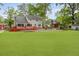 Wide shot of a backyard with pool, patio, large lawn and tree coverage at 22 Monte Sano Dr, Hanahan, SC 29410