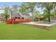 Expansive backyard featuring a swimming pool, deck, and lush green lawn perfect for outdoor enjoyment at 22 Monte Sano Dr, Hanahan, SC 29410