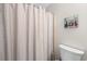 Bathroom with a shower curtain and a toilet with modern fixtures at 22 Monte Sano Dr, Hanahan, SC 29410