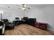 This bedroom offers hardwood floors, natural light, and a ceiling fan at 22 Monte Sano Dr, Hanahan, SC 29410