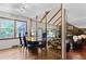 A unique dining room with an eclectic table, with natural light and views of the living room at 22 Monte Sano Dr, Hanahan, SC 29410