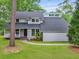 Charming home exterior featuring a well-manicured lawn, inviting front porch, and architectural detail at 22 Monte Sano Dr, Hanahan, SC 29410