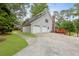 Large home featuring an attached garage with a wide driveway and green lawn at 22 Monte Sano Dr, Hanahan, SC 29410