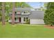 Charming home with mature landscaping, a covered porch, and a manicured lawn at 22 Monte Sano Dr, Hanahan, SC 29410