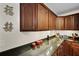 A kitchen featuring dark wood cabinets, granite countertops, and modern appliances at 22 Monte Sano Dr, Hanahan, SC 29410