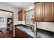 Kitchen area boasts granite countertops, wood cabinets, and undermount sink at 22 Monte Sano Dr, Hanahan, SC 29410