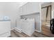Bright laundry room with white cabinets, washer, and dryer at 22 Monte Sano Dr, Hanahan, SC 29410