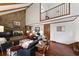 This living room has wood floors, stone fireplace, vaulted ceiling, and lots of light at 22 Monte Sano Dr, Hanahan, SC 29410