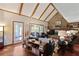 Living room boasting a vaulted ceiling, stone fireplace, and wood floors at 22 Monte Sano Dr, Hanahan, SC 29410