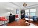 Cozy living room features hardwood floors, blue chairs, and a custom wine rack cabinet at 22 Monte Sano Dr, Hanahan, SC 29410