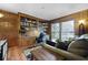 Cozy office with wood paneling, built-in shelving, and a comfortable seating area at 22 Monte Sano Dr, Hanahan, SC 29410
