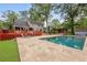 Backyard with large pool, patio, spacious deck, and lush landscaping at 22 Monte Sano Dr, Hanahan, SC 29410