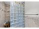 Shower featuring unique glass block and neutral tones for a spa-like experience at 22 Monte Sano Dr, Hanahan, SC 29410