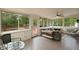 Spacious sunroom with large windows offering views of the backyard and deck at 22 Monte Sano Dr, Hanahan, SC 29410