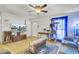 Bright living room with a ceiling fan, flat-screen TV, and comfortable seating area at 225 Arbor Rd, Summerville, SC 29485
