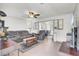 Spacious living room with plush couches, ceiling fan, and view into dining area at 225 Arbor Rd, Summerville, SC 29485