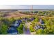 Aerial view of homes in a beautiful community with mature trees and landscaping near marshland and waterfront at 2524 Deer Walk Way, Mount Pleasant, SC 29466