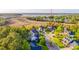 Aerial view of waterfront homes surrounded by mature trees and well-manicured lawns at 2524 Deer Walk Way, Mount Pleasant, SC 29466