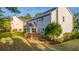 Well-manicured backyard featuring a wooden deck and lush green lawn with mature trees and shrubbery at 2524 Deer Walk Way, Mount Pleasant, SC 29466