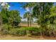 Backyard view shows scenic wetlands viewed through the lush, tropical backyard foliage at 2524 Deer Walk Way, Mount Pleasant, SC 29466