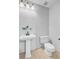 Bright powder room with a pedestal sink, neutral wall paint, and classic design at 2524 Deer Walk Way, Mount Pleasant, SC 29466