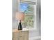 Bedroom dresser with a sleek modern lamp and natural light coming through the window at 2524 Deer Walk Way, Mount Pleasant, SC 29466
