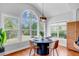 Bright breakfast nook features a round table, wood floors, and large windows with views at 2524 Deer Walk Way, Mount Pleasant, SC 29466