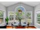 Charming breakfast nook with many windows and a stylish pendant light fixture above the table at 2524 Deer Walk Way, Mount Pleasant, SC 29466