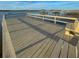 Wide angle view of a wooden dock with railings and built-in benches overlooking the open water at 2524 Deer Walk Way, Mount Pleasant, SC 29466
