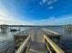 View of wooden dock and water, and nearby covered pier at 2524 Deer Walk Way, Mount Pleasant, SC 29466