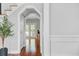 Bright entryway featuring hardwood floors, white trim, and a glimpse of a room with French doors at 2524 Deer Walk Way, Mount Pleasant, SC 29466