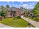Beautiful two-story brick home with lush landscaping, attached garage, and extended driveway at 2524 Deer Walk Way, Mount Pleasant, SC 29466