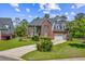 Brick home showing off an attached garage and driveway, complimented by a landscaped front yard at 2524 Deer Walk Way, Mount Pleasant, SC 29466