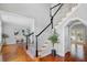 Interior foyer with hardwood floors, stairs, black and white bannister, and office view at 2524 Deer Walk Way, Mount Pleasant, SC 29466