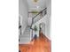 Interior foyer with hardwood floors, stairs, black and white bannister, and cased openings at 2524 Deer Walk Way, Mount Pleasant, SC 29466