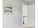 Hallway with a coastal-themed art piece and an open doorway with an attractive view beyond at 2524 Deer Walk Way, Mount Pleasant, SC 29466