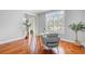 Well-lit office space boasting hardwood floors, a modern desk, and windows with plantation shutters at 2524 Deer Walk Way, Mount Pleasant, SC 29466