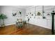Stylish home office with a glass-top desk, built-in shelves, and ample natural light at 2524 Deer Walk Way, Mount Pleasant, SC 29466