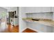 Kitchen features stainless appliances, white cabinets, granite countertops, and hardwood floors at 2524 Deer Walk Way, Mount Pleasant, SC 29466