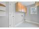 Bright laundry room with overhead cabinet and window at 2524 Deer Walk Way, Mount Pleasant, SC 29466
