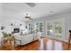 Cozy living room with a fireplace, wood floors, a comfortable sofa, and access to a deck at 2524 Deer Walk Way, Mount Pleasant, SC 29466