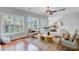 Bright living area with hardwood floors and large windows showcasing outdoor views at 2524 Deer Walk Way, Mount Pleasant, SC 29466