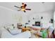 Comfortable living room featuring fireplace, ceiling fan, and built-in cabinetry at 2524 Deer Walk Way, Mount Pleasant, SC 29466