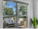 Window view of the outdoor patio area with comfortable seating, a table, and serene natural scenery at 2524 Deer Walk Way, Mount Pleasant, SC 29466