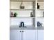 Built-in white shelving unit with stylish decor items, offering ample storage and display space at 2524 Deer Walk Way, Mount Pleasant, SC 29466